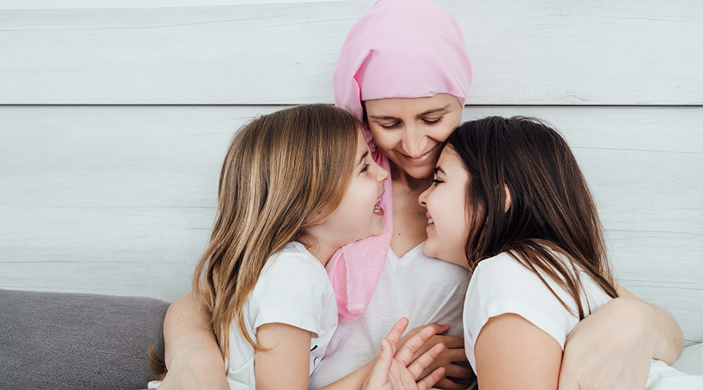 Breast cancer patient and two young girls